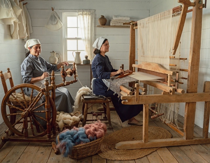Women spinning wool into yarn and weaving cloth